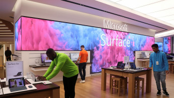 Employees work at Microsoft's new Oxford Circus store ahead of its opening in London