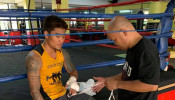 Mark Magsayo being taped up before training 