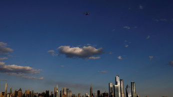 A JetBlue A320 aircraft conducts a flyover salute of New York City to honor frontline healthcare workers during the outbreak of the coronavirus disease (COVID-19), as seen from Weehawken, New Jersey