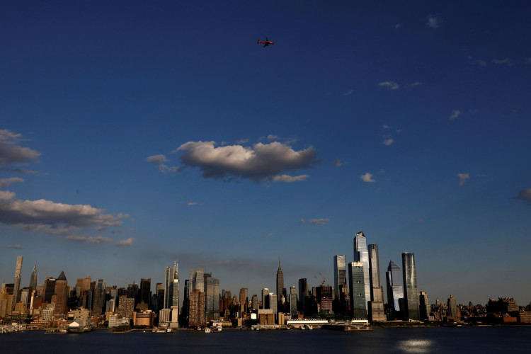 A JetBlue A320 aircraft conducts a flyover salute of New York City to honor frontline healthcare workers during the outbreak of the coronavirus disease (COVID-19), as seen from Weehawken, New Jersey