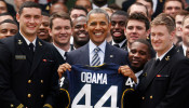 FILE PHOTO: U.S. President Barack Obama stands with a United States Naval Academy football jersey after presenting the Commander-in-Chief Trophy to the team in the Rose Garden at the White House in Washington.