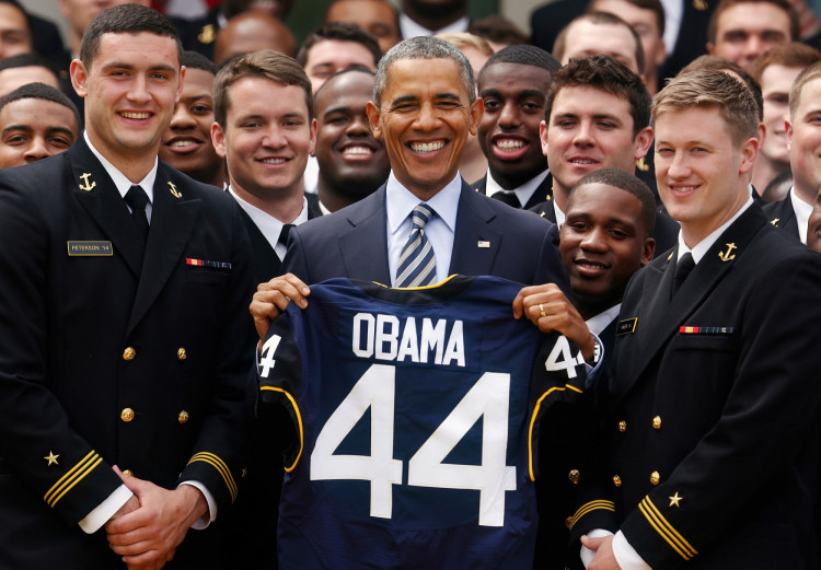 FILE PHOTO: U.S. President Barack Obama stands with a United States Naval Academy football jersey after presenting the Commander-in-Chief Trophy to the team in the Rose Garden at the White House in Washington.