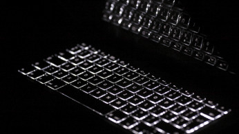 Backlit keyboard is reflected in screen of Apple Macbook Pro notebook computer in Warsaw February 6, 2012.