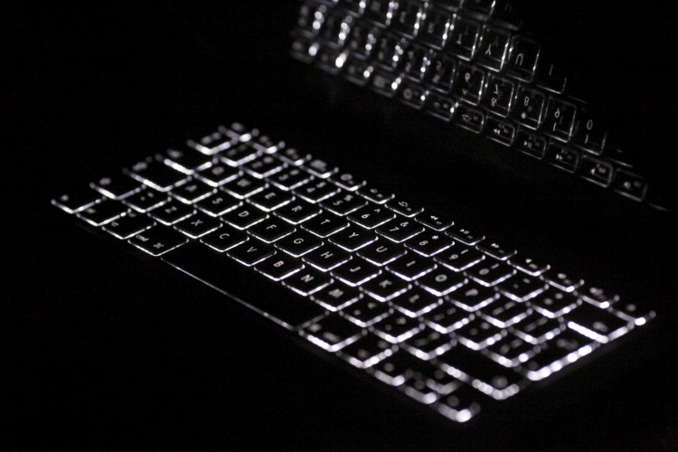 Backlit keyboard is reflected in screen of Apple Macbook Pro notebook computer in Warsaw February 6, 2012.