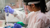 Scientists work in a lab testing COVID-19 samples at New York City's health department, during the outbreak of the coronavirus disease (COVID-19) in New York
