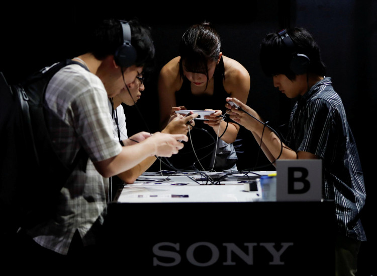 Visitors try a gaming program on Sony's Xperia smartphone at Tokyo Game Show 2019 in Chiba, east of Tokyo, Japan, September 12, 2019. 