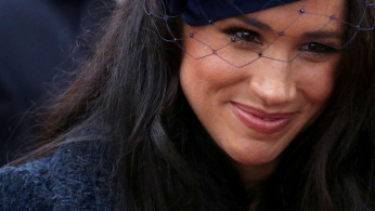 FILE PHOTO: Britain's Prince Harry and Meghan, Duchess of Sussex, visit the Field of Remembrance at Westminster Abbey in London