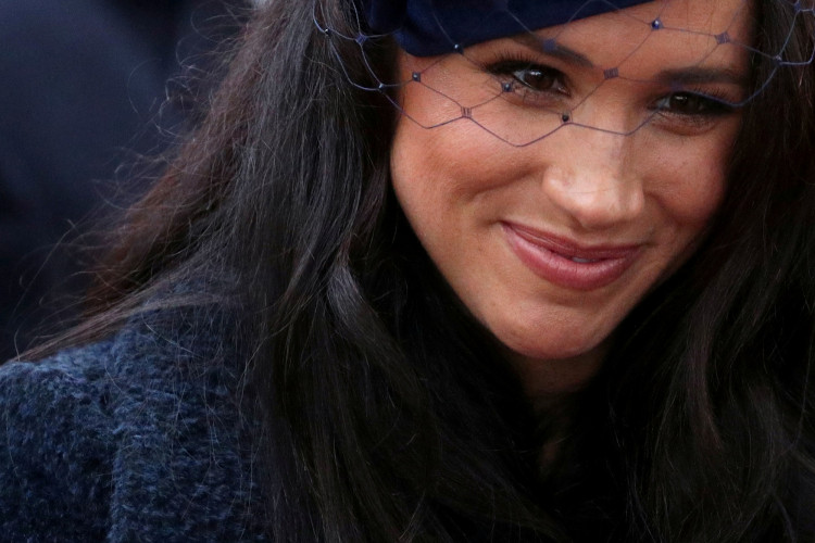FILE PHOTO: Britain's Prince Harry and Meghan, Duchess of Sussex, visit the Field of Remembrance at Westminster Abbey in London