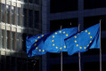  European Union flags fly outside the European Commission headquarters in Brussels, Belgium.