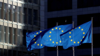  European Union flags fly outside the European Commission headquarters in Brussels, Belgium.