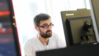 A programmer works on a computer in Belgrade