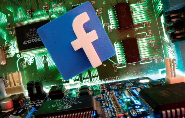 Facebook symbol is seen on a motherboard in this picture illustration