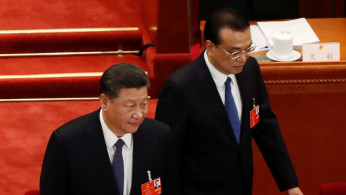 Chinese President Xi Jinping and Premier Li Keqiang arrive at the opening session of NPC in Beijing