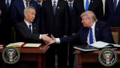 FILE PHOTO: Chinese Vice Premier Liu He and U.S. President Donald Trump shake hands after signing 