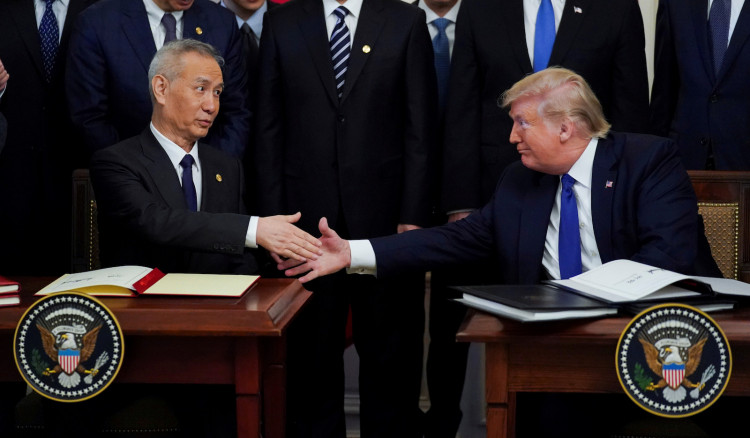 FILE PHOTO: Chinese Vice Premier Liu He and U.S. President Donald Trump shake hands after signing "phase one" of the U.S.-China trade agreement at the White House in Washington