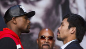 FILE PHOTO: Undefeated WBC/WBA welterweight champion Floyd Mayweather Jr of the U.S. and WBO welterweight champion Manny Pacquiao of the Philippines face off during a final news conference at the MGM 