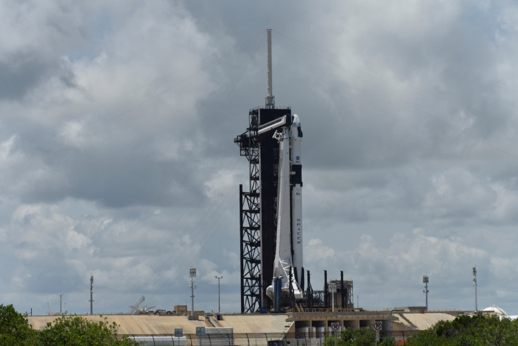 The SpaceX Crew Dragon spacecraft sits atop a Falcon 9 booster rocket on Pad39A