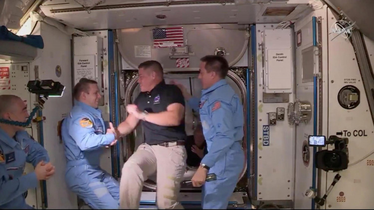 NASA astronaut Bob Behnken and Doug Hurley arrive at the International Space Station aboard SpaceX's Crew Dragon capsule in this still image taken from video May 31, 2020. 