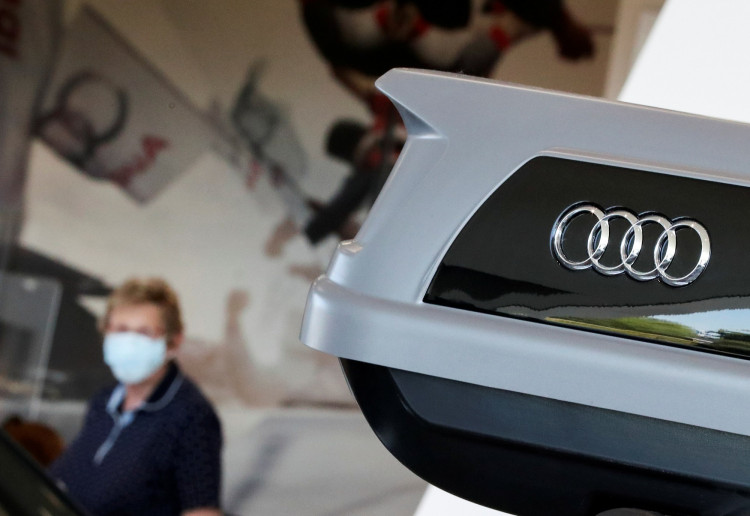 A customer visits the showroom at the Audi Center Brussels car dealer wearing a protective mask, amid the coronavirus disease (COVID-19) outbreak in Brussels