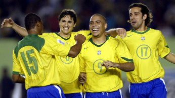 FILE PHOTO: Brazil's Ronaldo celebrates with team mates after scoring his third goal against Argentina