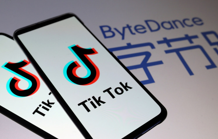 Tik Tok logos are seen on smartphones in front of a displayed ByteDance logo in this illustration taken November 27, 2019.