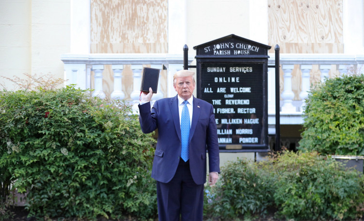 U.S. President Donald Trump holds up a Bible as he stands in front of St. John's Episcopal Church across from the White House