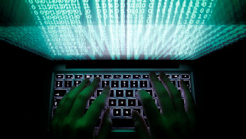 A man types on a computer keyboard in Warsaw in this February 28, 2013 illustration file picture.