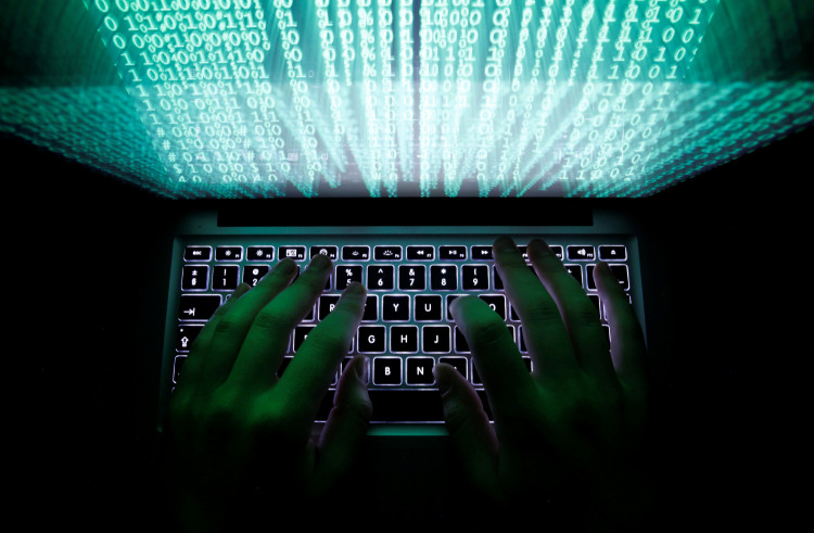 A man types on a computer keyboard in Warsaw in this February 28, 2013 illustration file picture.