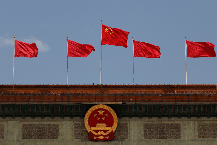 Chinese flags flutter at the Great Hall of the People in Beijing