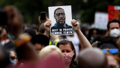 People attend a public memorial after the death in Minneapolis police custody of George Floyd in the Brooklyn borough of New York City