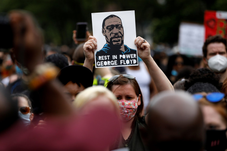 People attend a public memorial after the death in Minneapolis police custody of George Floyd in the Brooklyn borough of New York City