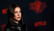 Cast member Millie Bobby Brown poses at the premiere for the second season of the television series 