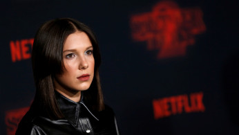Cast member Millie Bobby Brown poses at the premiere for the second season of the television series 