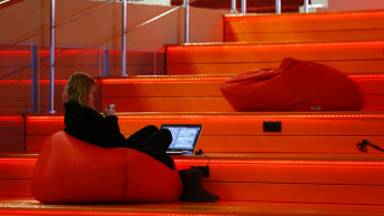 A woman with a laptop is seen in Hi-Tech Park Belarus building in Minsk, Belarus March 17, 2016. 
