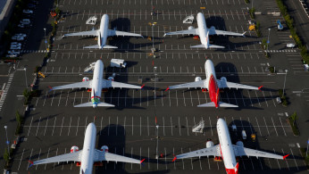 Boeing 737 Max aircraft are parked in a parking lot at Boeing Field in this aerial photo taken over Seattle