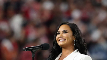 Demi Lovato sings the U.S. national anthem before the start of Super Bowl LIV in Miami. 