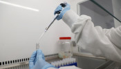 Scientists are seen working at Cobra Biologics, they are working on a potential vaccine for COVID-19, following the outbreak of the coronavirus disease (COVID-19), in Keele