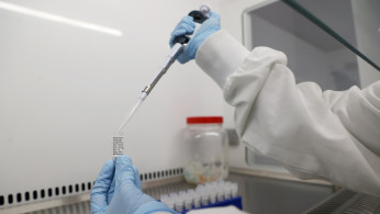 Scientists are seen working at Cobra Biologics, they are working on a potential vaccine for COVID-19, following the outbreak of the coronavirus disease (COVID-19), in Keele