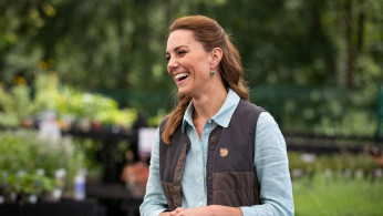 Britain's Catherine, Duchess of Cambridge talks to the owners during her first public engagement since the lockdown 