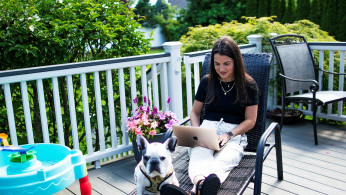Stephanie Ellis uses her laptop at her home in Marlboro, New Jersey