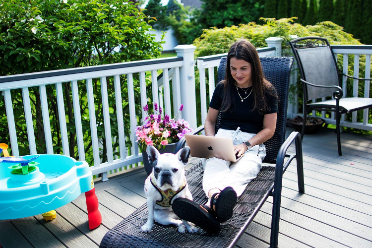 Stephanie Ellis uses her laptop at her home in Marlboro, New Jersey