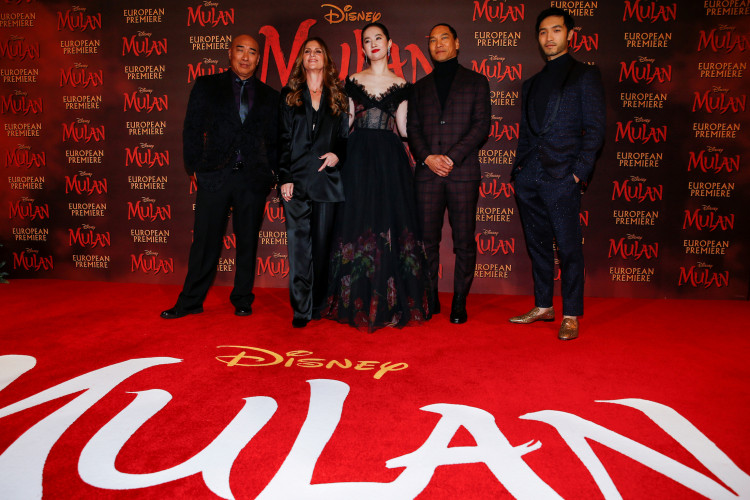 FILE PHOTO: Cast members Ron Yuan, Yifei Liu, Jason Scott Lee and Yoson An pose with director Niki Caro, at the European premiere for the film "Mulan" in London, Britain March 12, 2020. REUTERS/Henry Nicholls/File Photo
