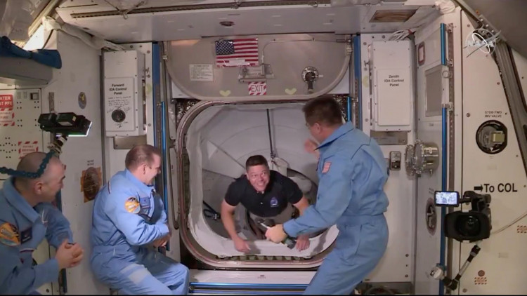 NASA astronaut Bob Behnken arrives at the International Space Station aboard SpaceX's Crew Dragon capsule in this still image taken from video