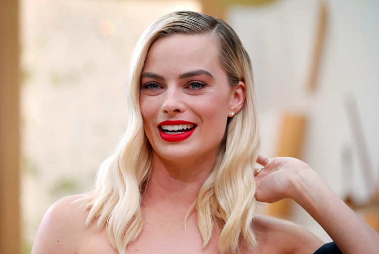 FILE PHOTO: Margot Robbie poses on the red carpet during the Oscars arrivals at the 92nd Academy Awards in Hollywood, Los Angeles, California, U.S., February 9, 2020. REUTERS/Mike Blake/File Photo