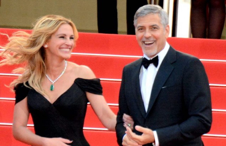Brad Pitt and George Clooney allegedly clashing over Julia Roberts. Photo by Georges Biard/Wikimedia Commons