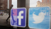 FILE PHOTO: Facebook and Twitter logos are seen on a shop window in Malaga, Spain, June 4, 2018. 