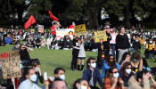 People attend a demonstration in solidarity with the Black Lives Matter (BLM) rallies in the United States