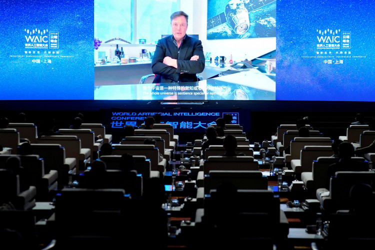 Tesla Inc Chief Executive Officer Elon Musk is seen on a screen during a video message