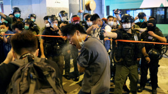 Police disperse pro-democracy protesters with pepper spray 