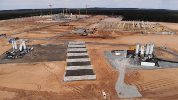 Cranes and first pillars for the future Tesla Gigafactory in Gruenheide near Berlin